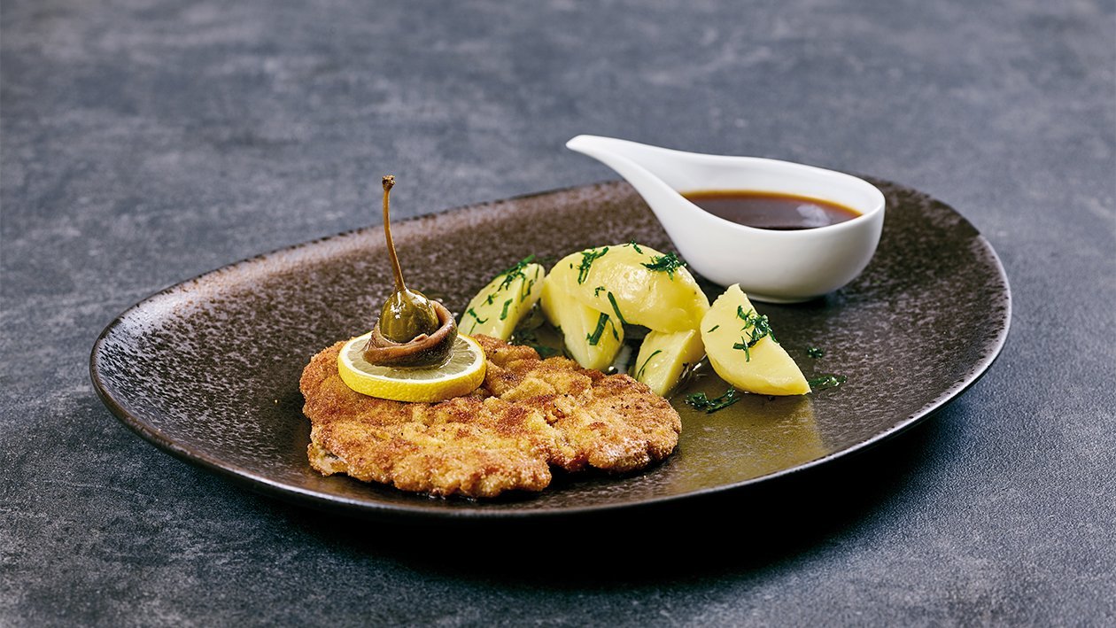 Schweineschnitzel "Wiener Art" mit Petersilien Kartoffeln –  